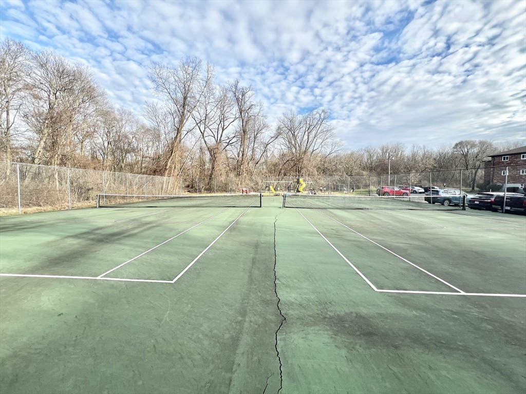 26 Bryon Road, Unit 3 Boston, MA 02467 - Photo 30 of 30 a view of a tennis ground with large trees