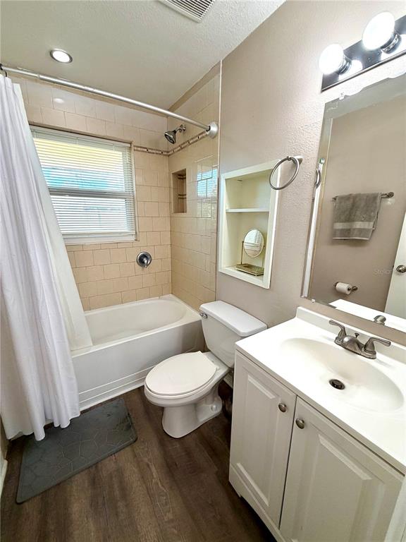 7974 Avenal Loop New Port Richey, FL 34655 - Photo 12 of 23 a bathroom with a sink toilet and shower