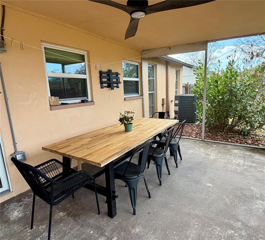 7974 Avenal Loop New Port Richey, FL 34655 - Photo 20 of 23 a dining room with furniture and window