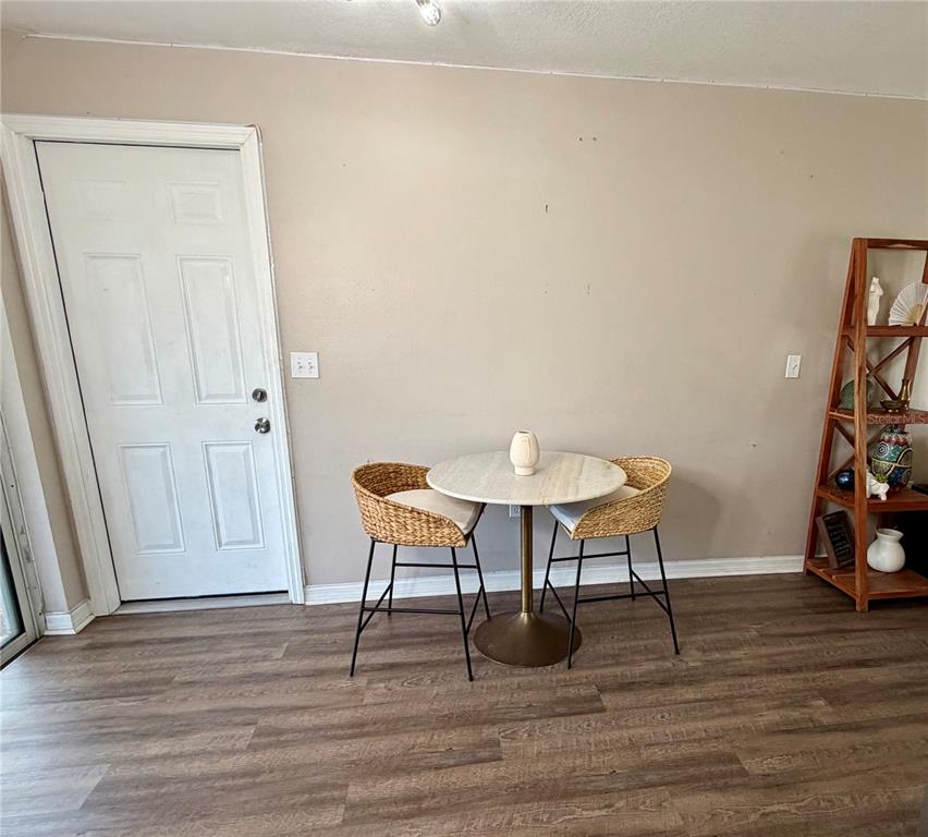 7974 Avenal Loop New Port Richey, FL 34655 - Photo 9 of 23 a view of a livingroom with furniture and a table