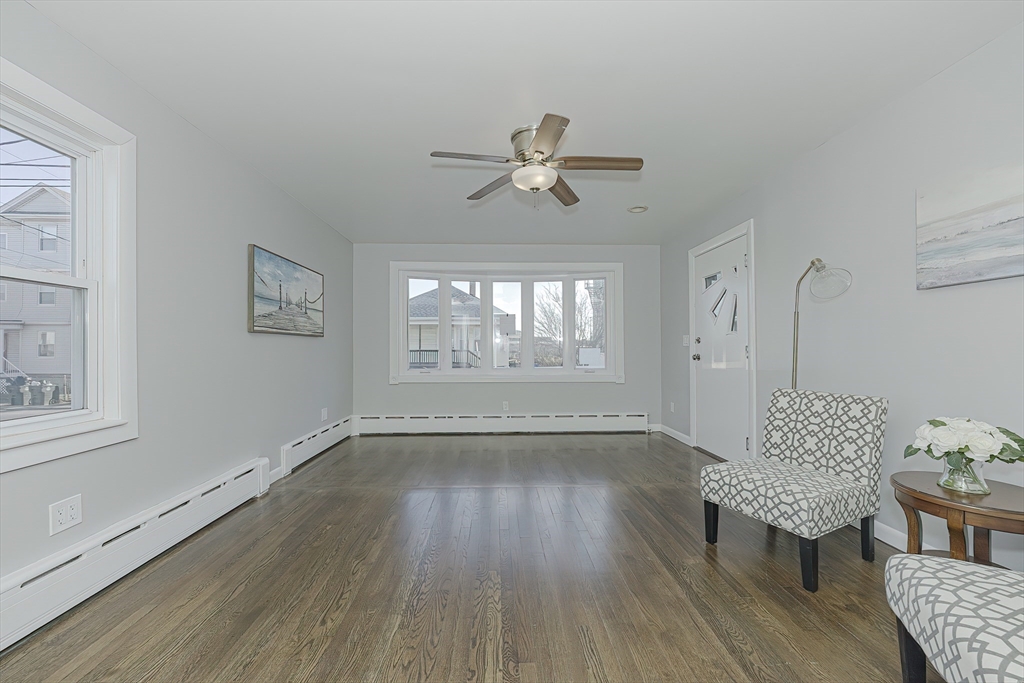 211 Jefferson Street Fall River, MA 02721 - Photo 8 of 17 wooden floor in an empty room with a window