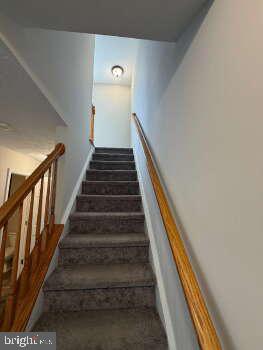 313 3rd Street Colonial Beach, VA 22443 - Photo 33 of 36 Inviting ascent to upper living spaces.