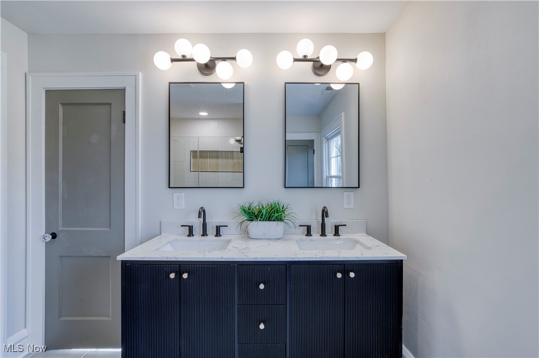 3081 Huntington Road Cleveland, OH 44120 - Photo 32 of 44 Full bathroom with double vanity and a sink