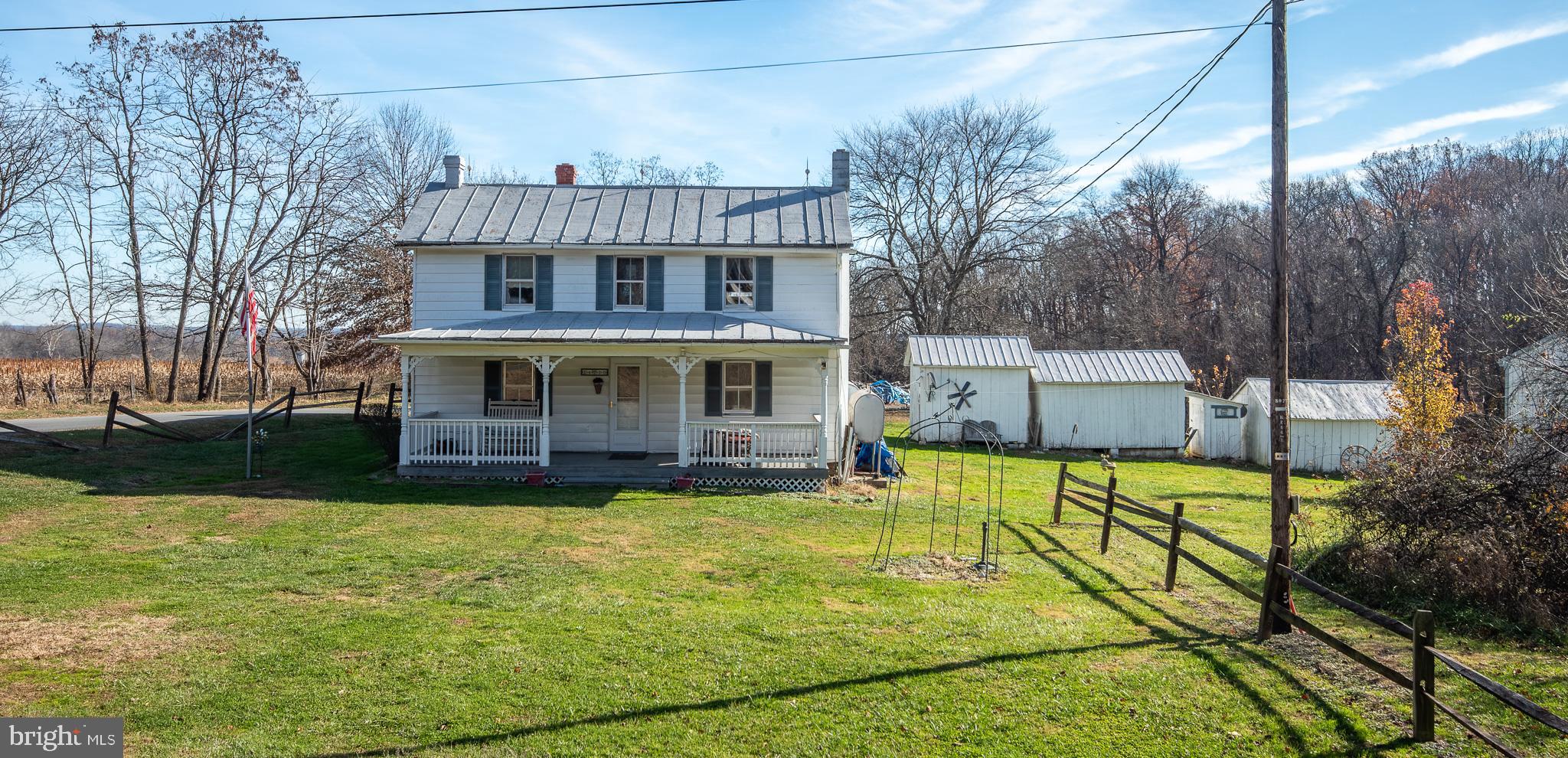 14735 Montresor Road Leesburg, VA 20176 - Photo 13 of 46 a view of house with garden and tall trees