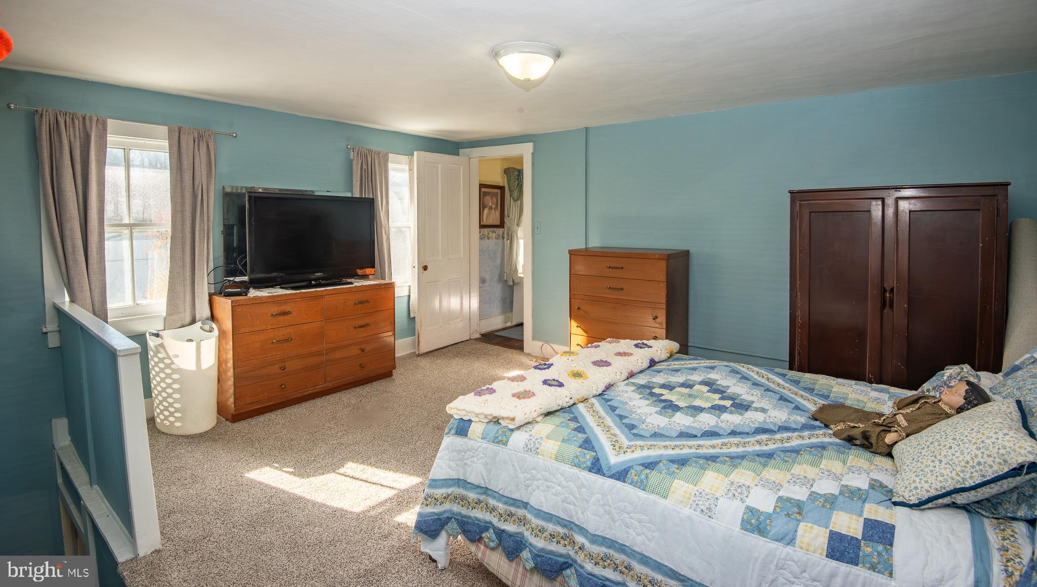 14735 Montresor Road Leesburg, VA 20176 - Photo 21 of 46 a bedroom with bed and flat screen tv