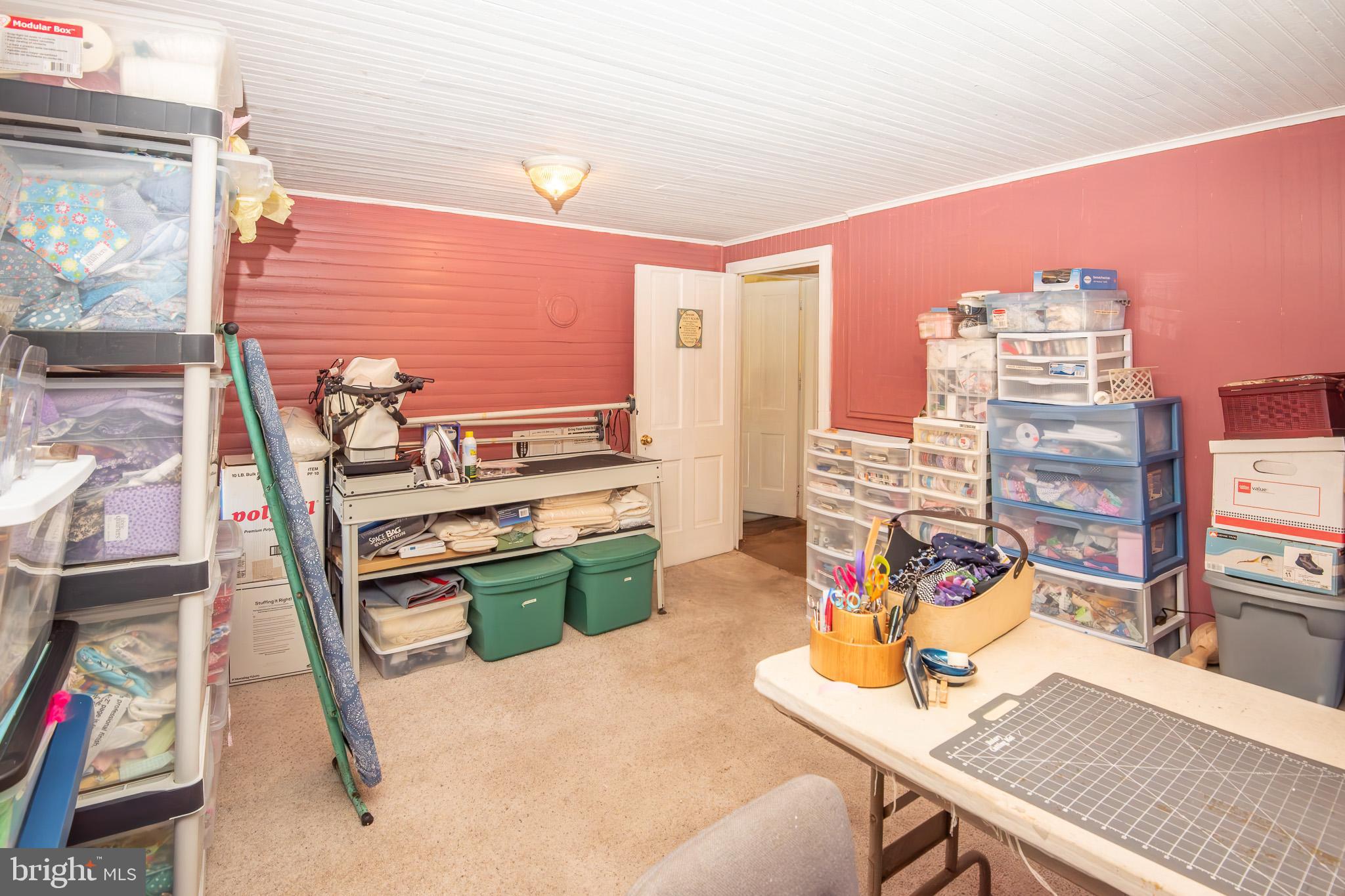 14735 Montresor Road Leesburg, VA 20176 - Photo 25 of 46 a reading room with furniture and a floor to ceiling window