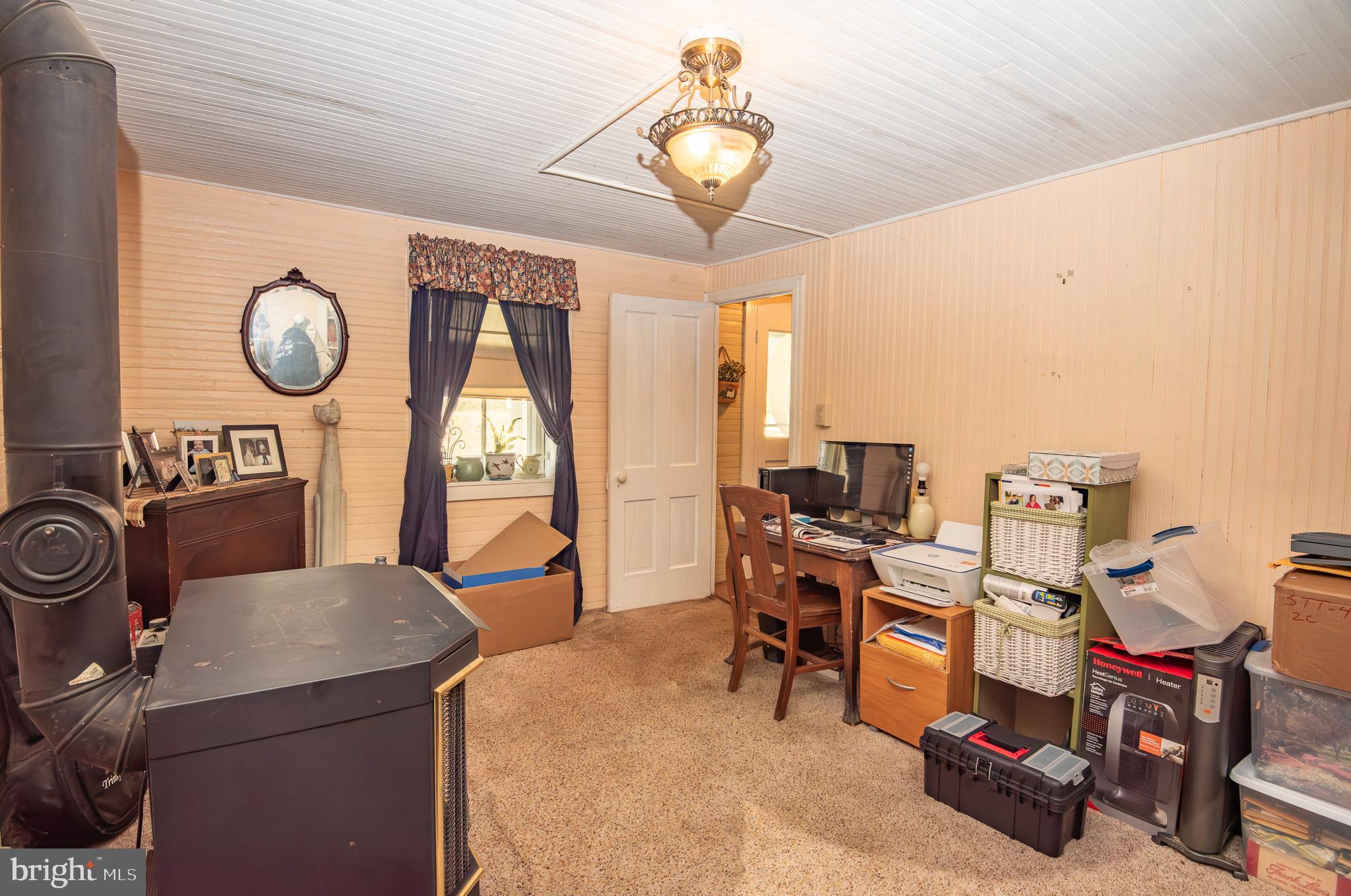 14735 Montresor Road Leesburg, VA 20176 - Photo 27 of 46 a living room with furniture a clock and a window