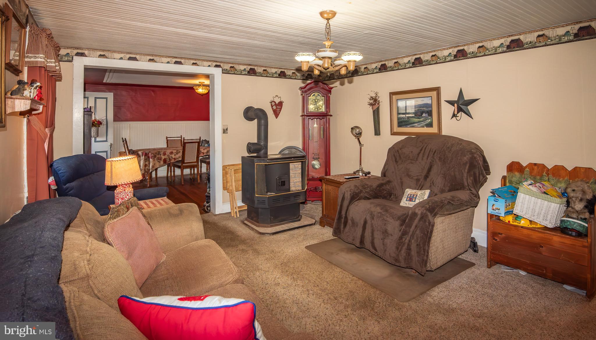14735 Montresor Road Leesburg, VA 20176 - Photo 28 of 46 a living room with furniture and a chandelier