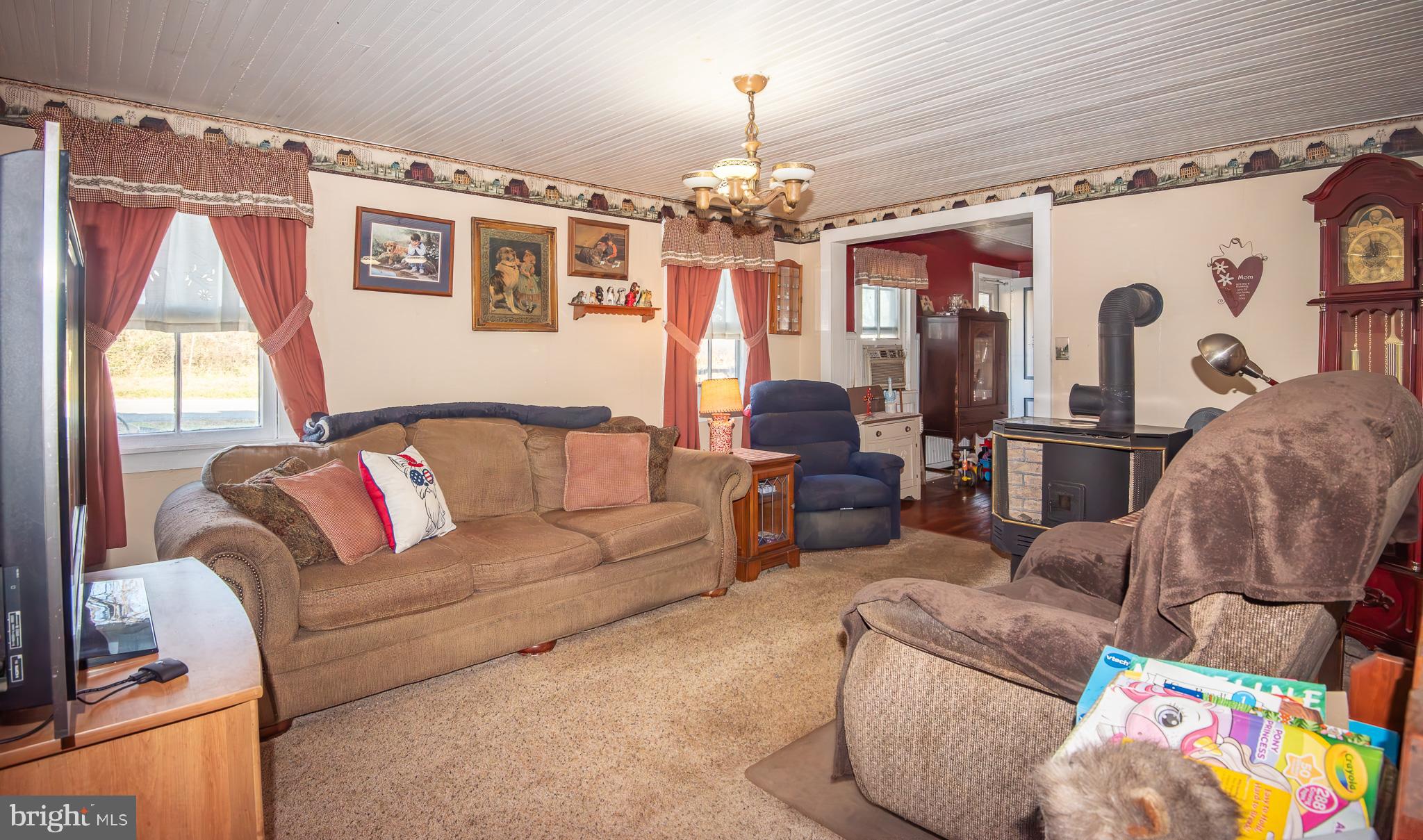 14735 Montresor Road Leesburg, VA 20176 - Photo 4 of 46 a living room with furniture and a chandelier