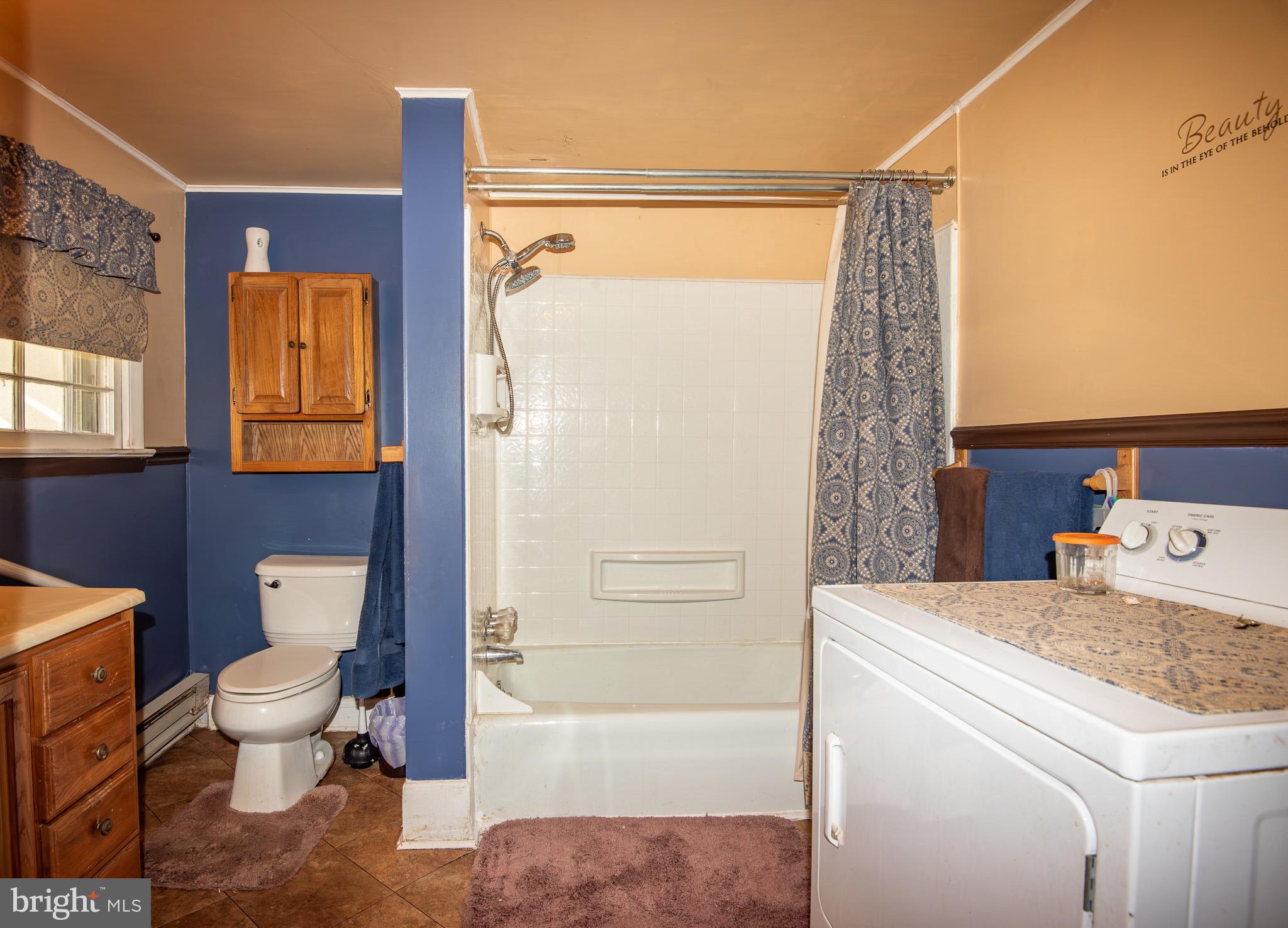 14735 Montresor Road Leesburg, VA 20176 - Photo 7 of 46 a bathroom with a sink toilet and shower