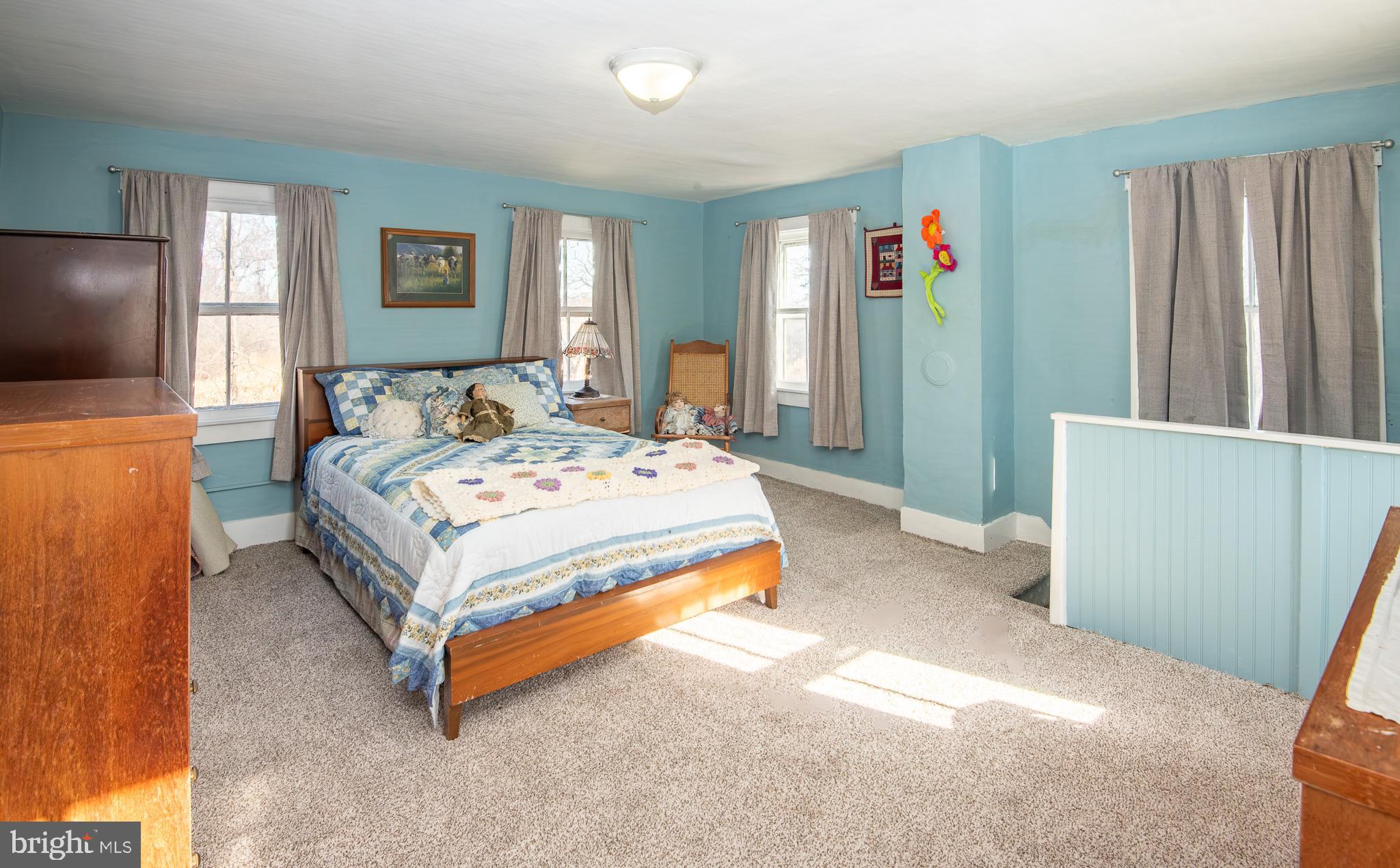 14735 Montresor Road Leesburg, VA 20176 - Photo 10 of 46 a bedroom with a bed and a flat screen tv