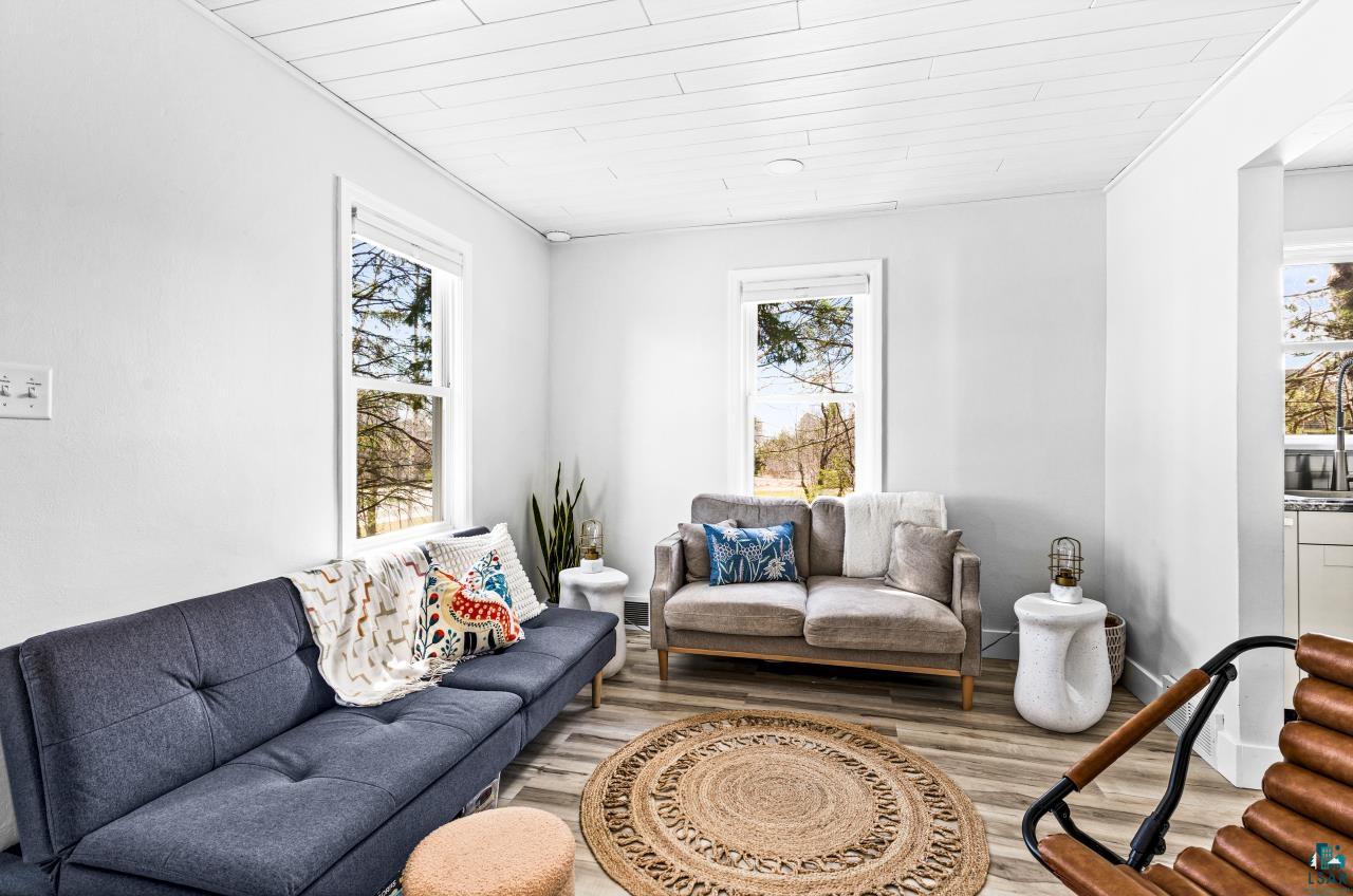 3645 Haines Road Hermantown, MN 55811 - Photo 19 of 35 Living area featuring light wood-finish flooring and a white shiplap ceiling