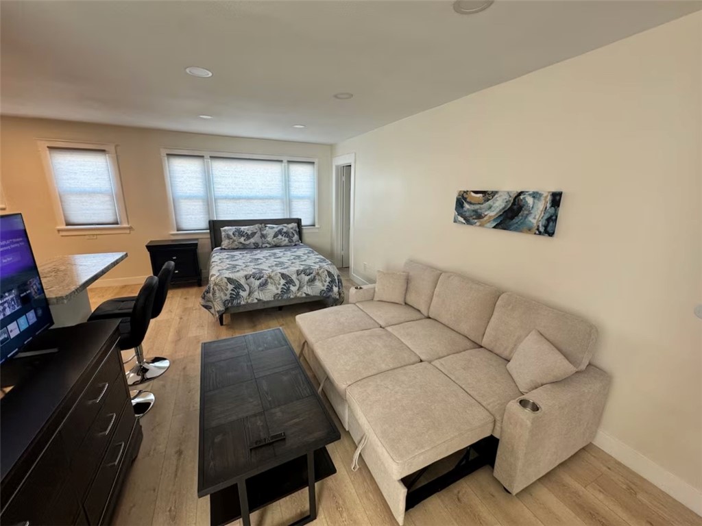 123 6th Street Huntington Beach, CA 92648 - Photo 3 of 7 a living room with furniture and a flat screen tv