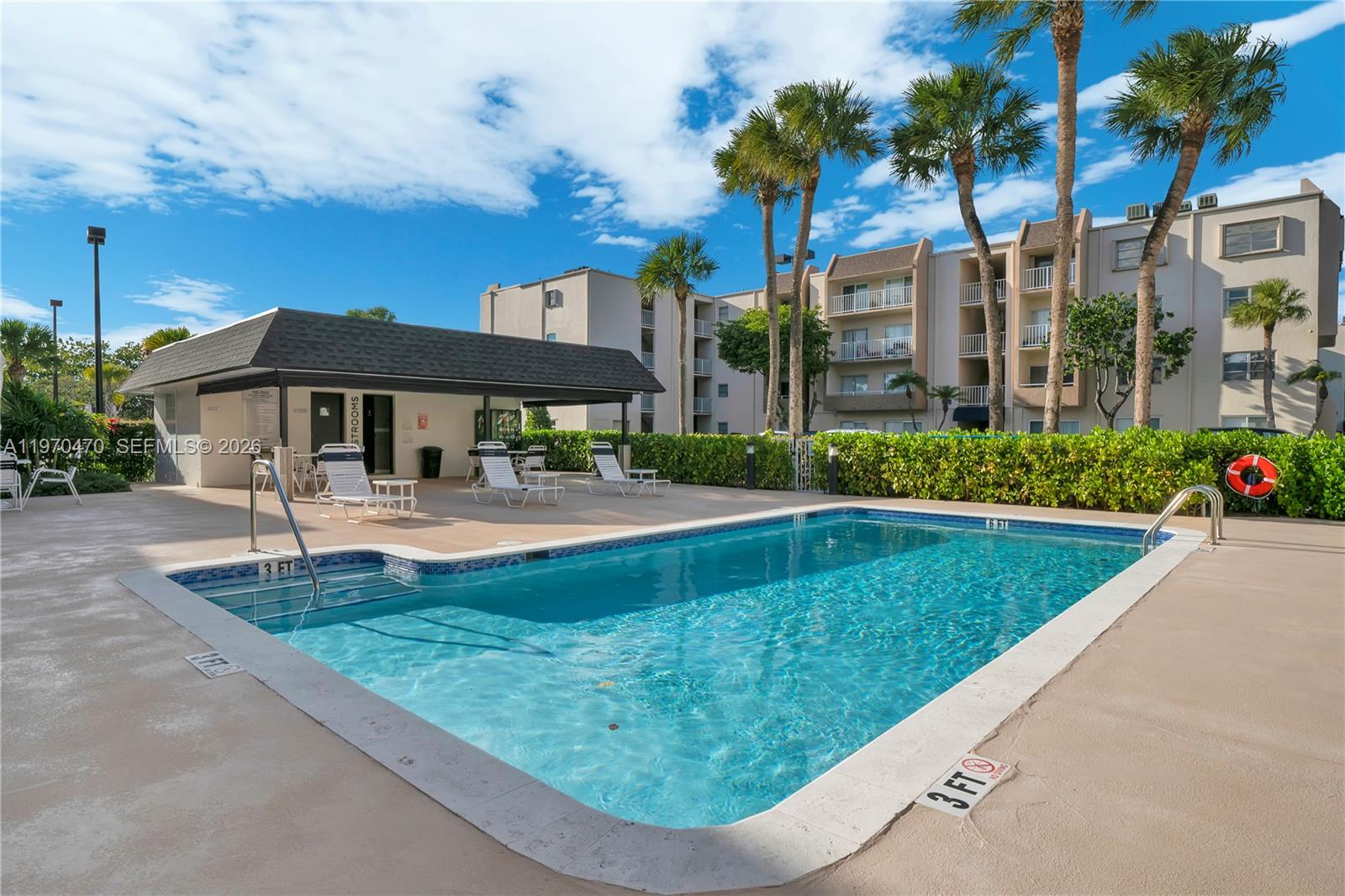 7747 Southwest 86th Street, Unit D403 Miami, FL 33143 - Photo 1 of 25 a view of a house with swimming pool and sitting area