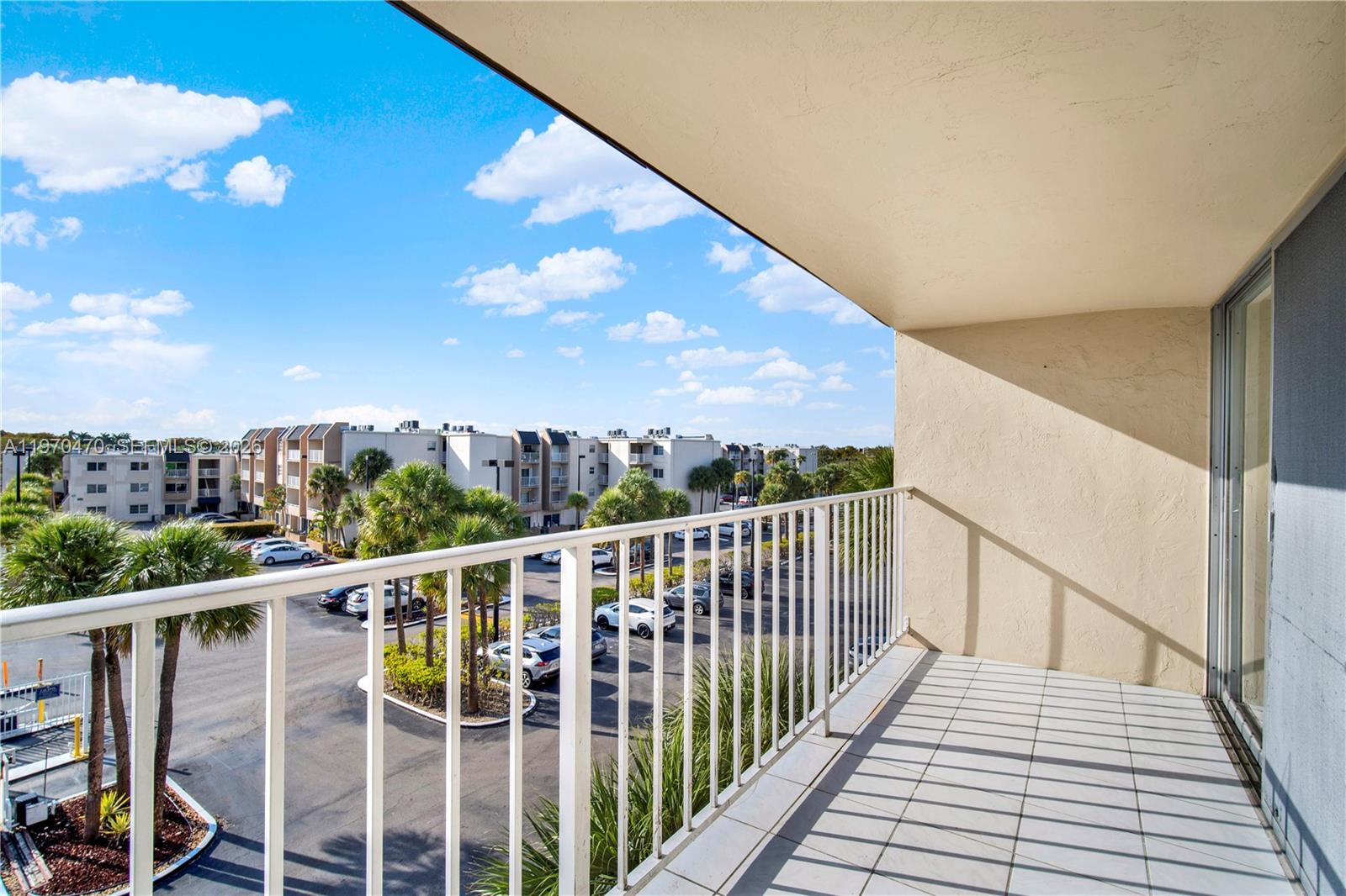 7747 Southwest 86th Street, Unit D403 Miami, FL 33143 - Photo 16 of 25 a view of a balcony with city view
