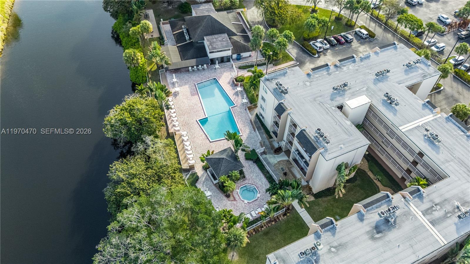 7747 Southwest 86th Street, Unit D403 Miami, FL 33143 - Photo 2 of 25 an aerial view of residential houses with outdoor space