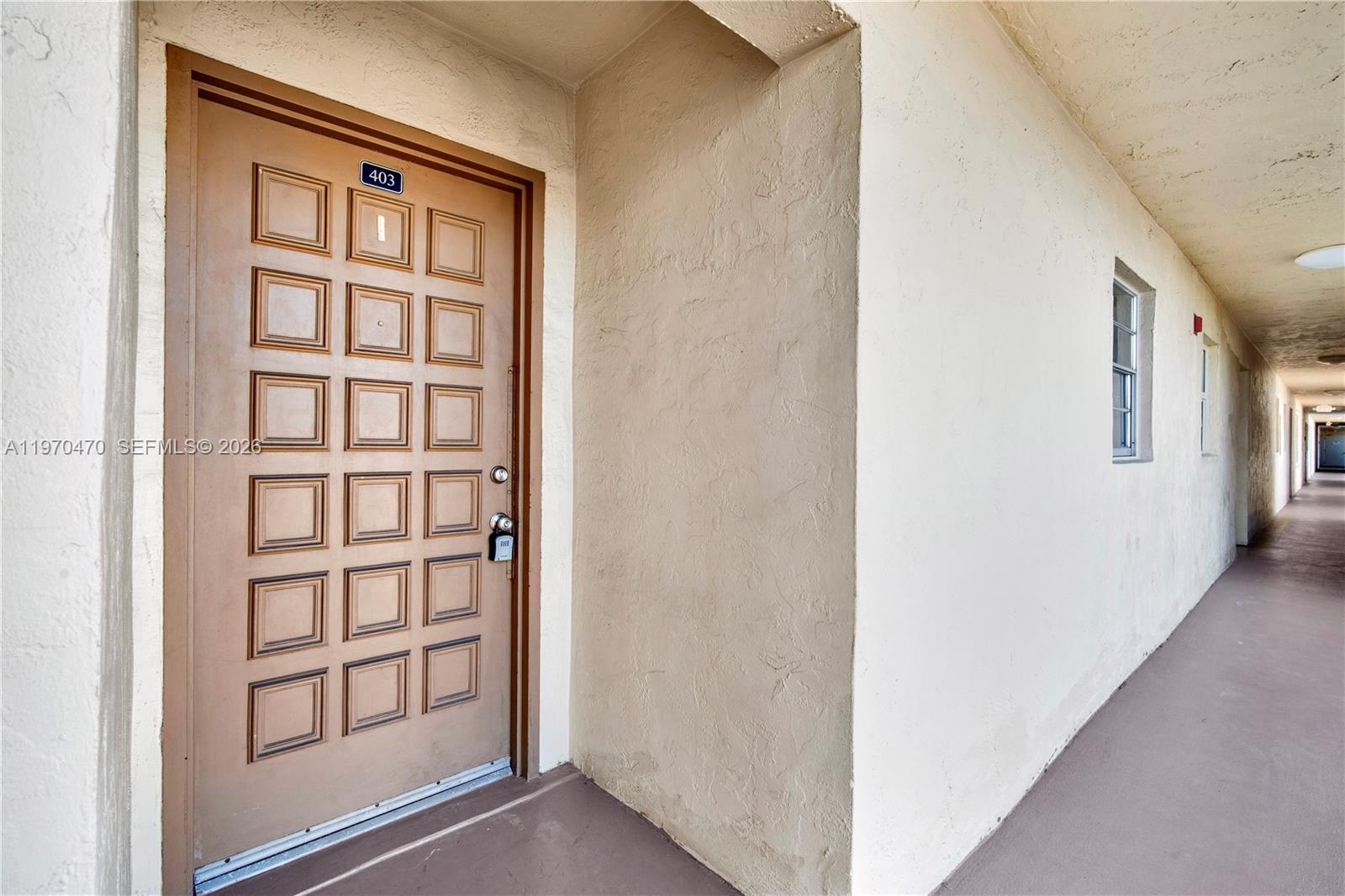 7747 Southwest 86th Street, Unit D403 Miami, FL 33143 - Photo 4 of 25 a view of front door