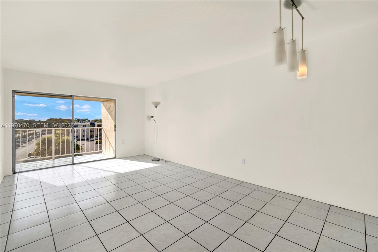 7747 Southwest 86th Street, Unit D403 Miami, FL 33143 - Photo 6 of 25 a view of an empty room and window