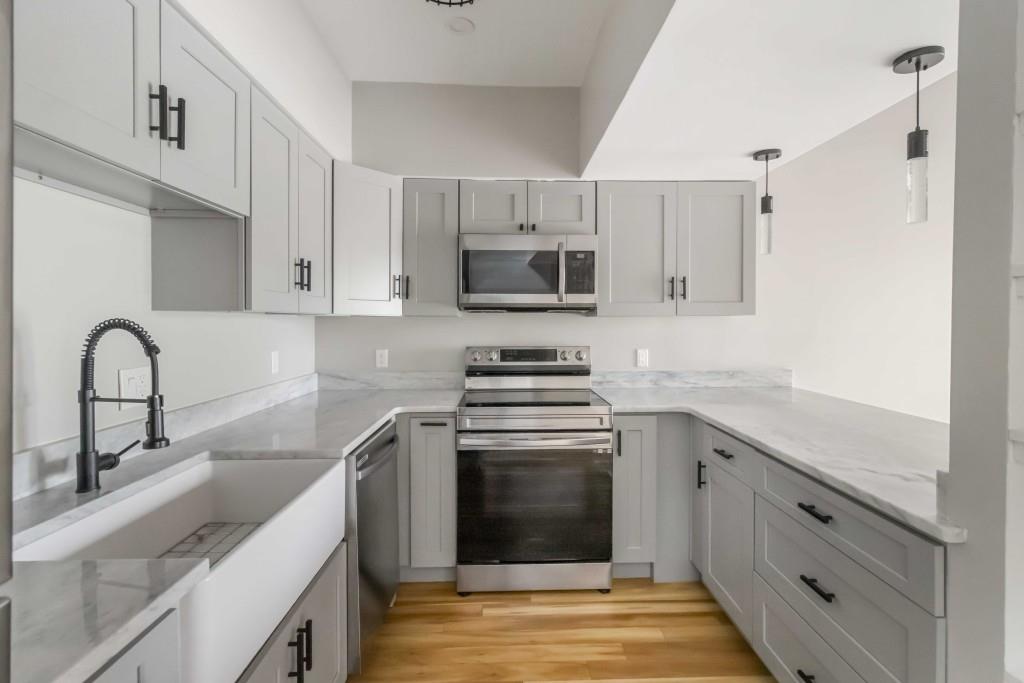 266 Clearview Court, Unit 266 Villa Rica, GA 30180 - Photo 11 of 32 a kitchen with cabinets stainless steel appliances and a sink