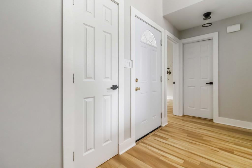 266 Clearview Court, Unit 266 Villa Rica, GA 30180 - Photo 21 of 32 a view of a hallway with wooden floor and closet area