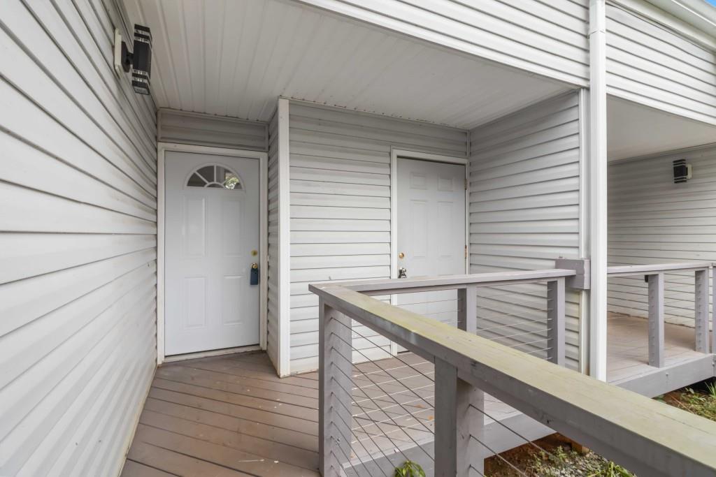 266 Clearview Court, Unit 266 Villa Rica, GA 30180 - Photo 4 of 32 a balcony view with a sink and wooden floor