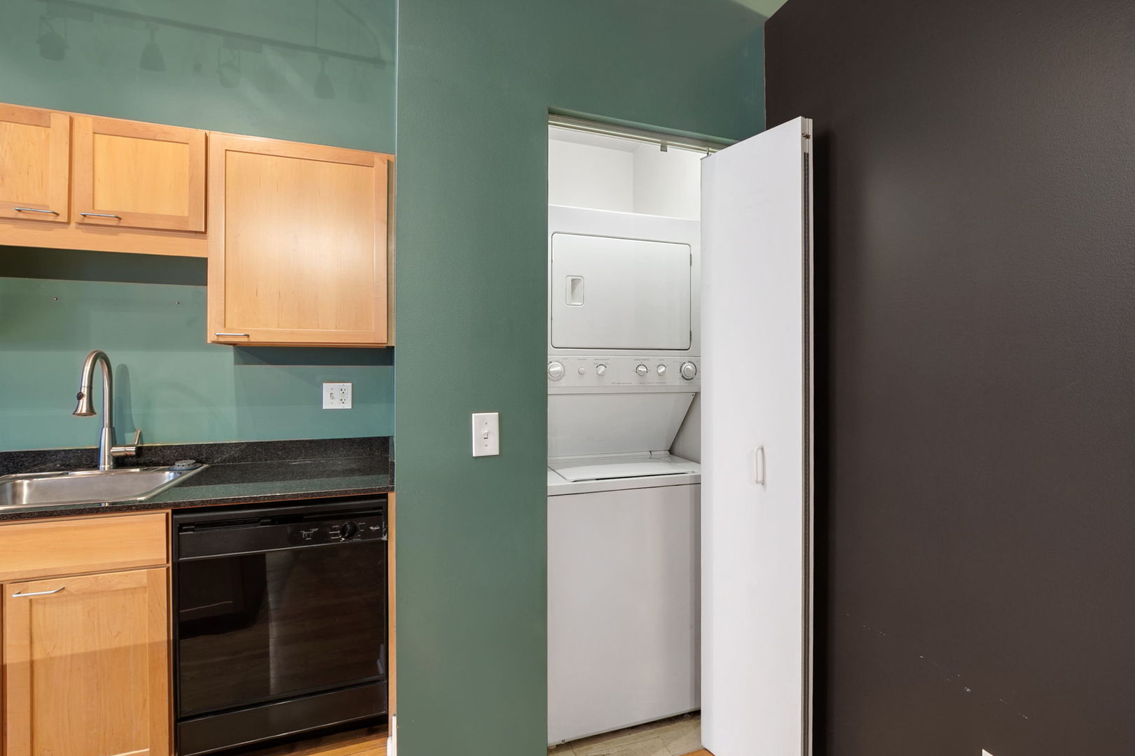 20 North State Street, Unit 611 Chicago, IL 60602 - Photo 11 of 17 a kitchen with a refrigerator and a sink