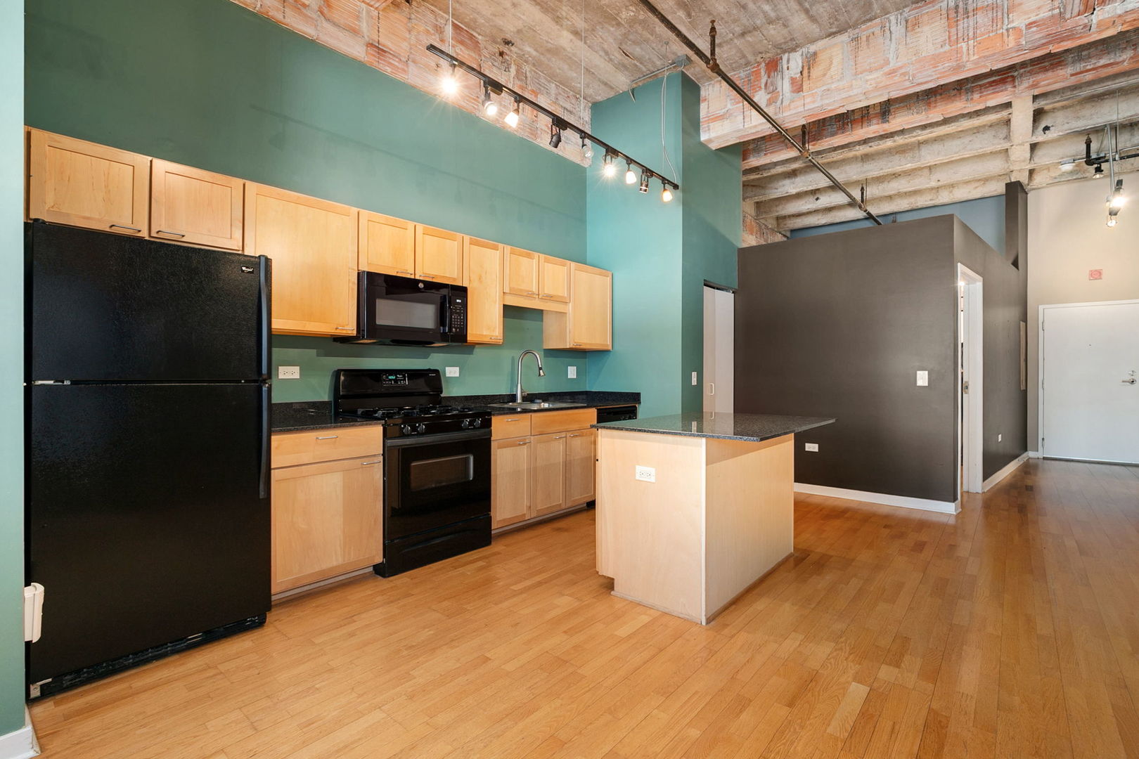 20 North State Street, Unit 611 Chicago, IL 60602 - Photo 10 of 17 a kitchen with a refrigerator and a stove