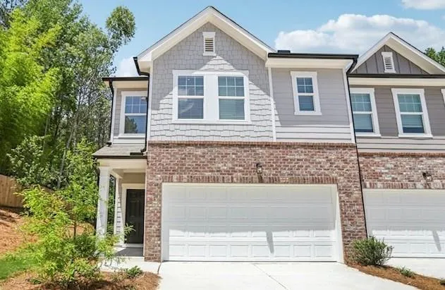 a front view of a house with yard