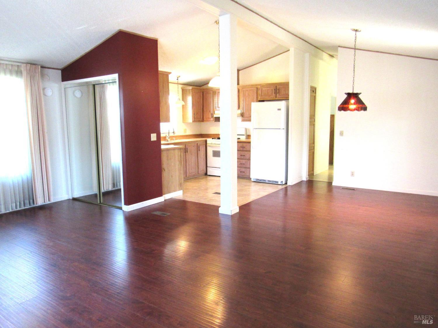 31 Ramon Street Sonoma, CA 95476 - Photo 10 of 24 an empty room with wooden floor and windows