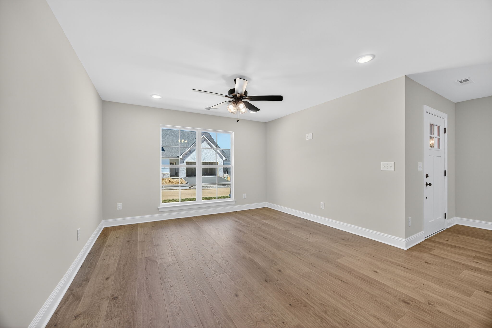 2111 Rylee Way, Unit 9 Greenbrier, TN 37073 - Photo 13 of 33 wooden floor in an empty room with a window