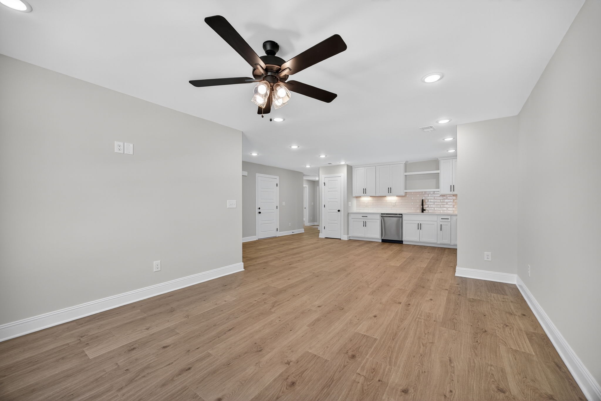 2111 Rylee Way, Unit 9 Greenbrier, TN 37073 - Photo 14 of 33 a view of a kitchen with a sink and wooden floor