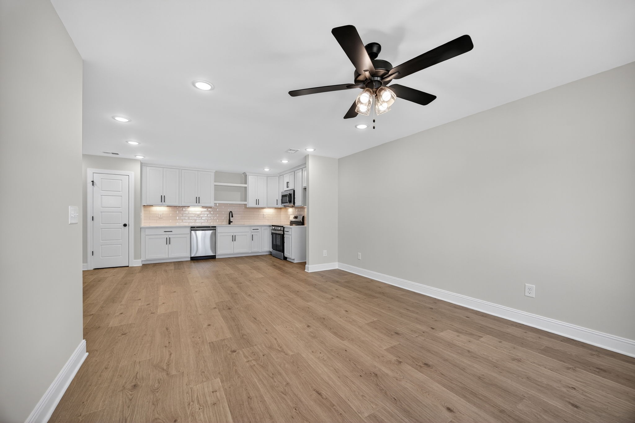 2111 Rylee Way, Unit 9 Greenbrier, TN 37073 - Photo 15 of 33 a view of a kitchen with a sink and wooden floor