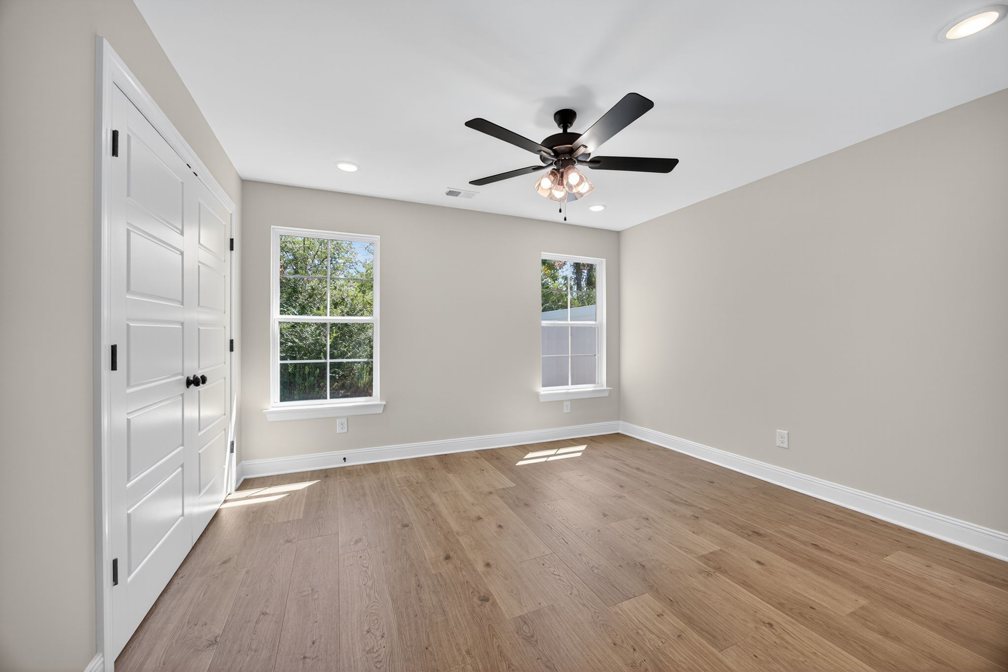 2111 Rylee Way, Unit 9 Greenbrier, TN 37073 - Photo 18 of 33 a view of an empty room with a window and wooden floor