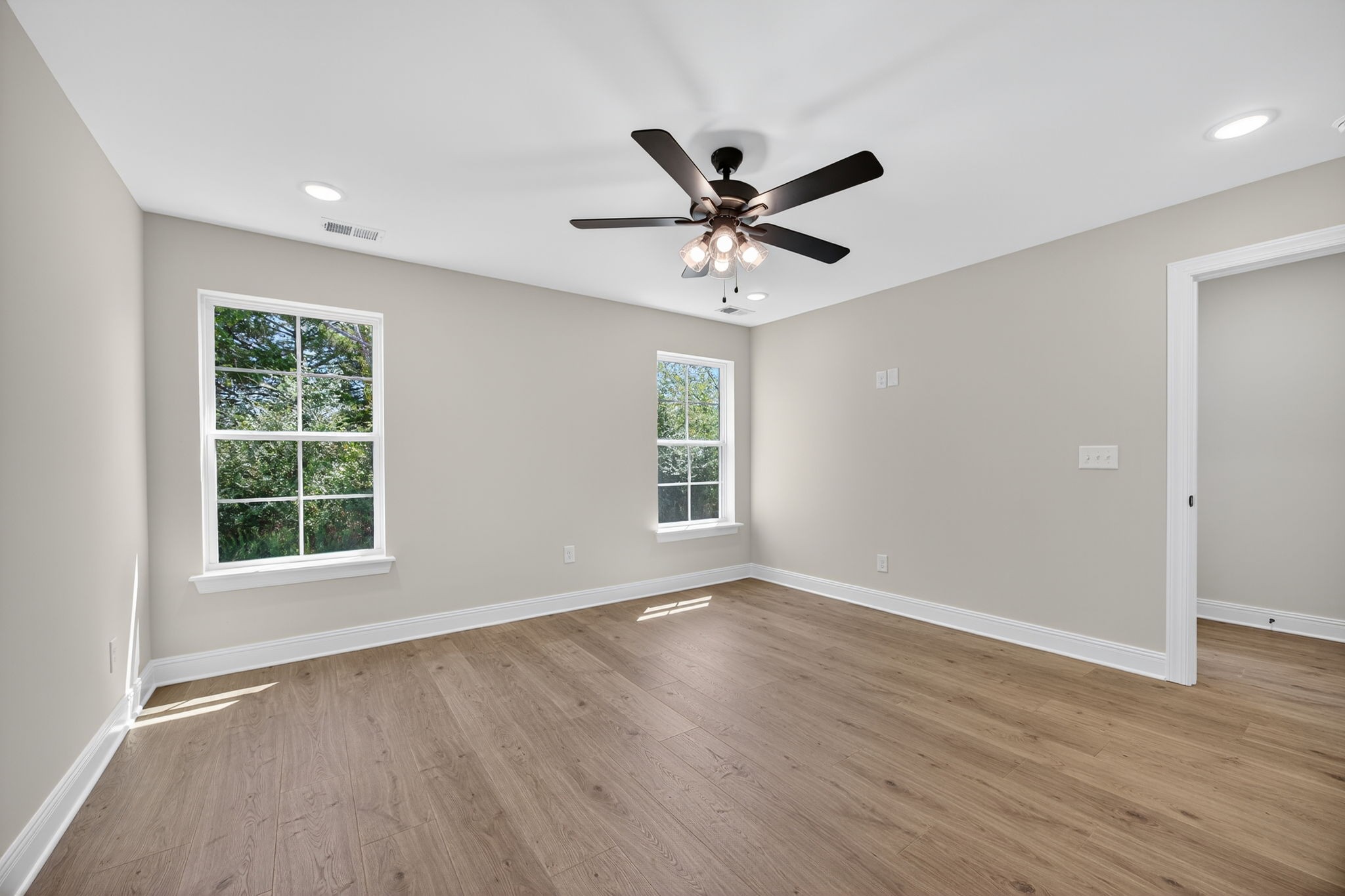 2111 Rylee Way, Unit 9 Greenbrier, TN 37073 - Photo 23 of 33 a view of an empty room with wooden floor and a window