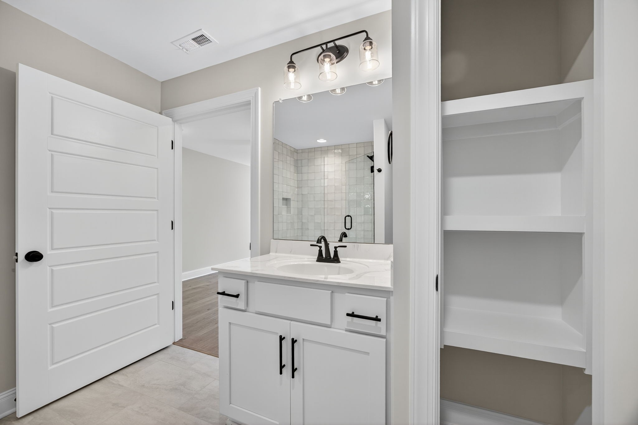 2111 Rylee Way, Unit 9 Greenbrier, TN 37073 - Photo 29 of 33 a bathroom with a sink and a mirror