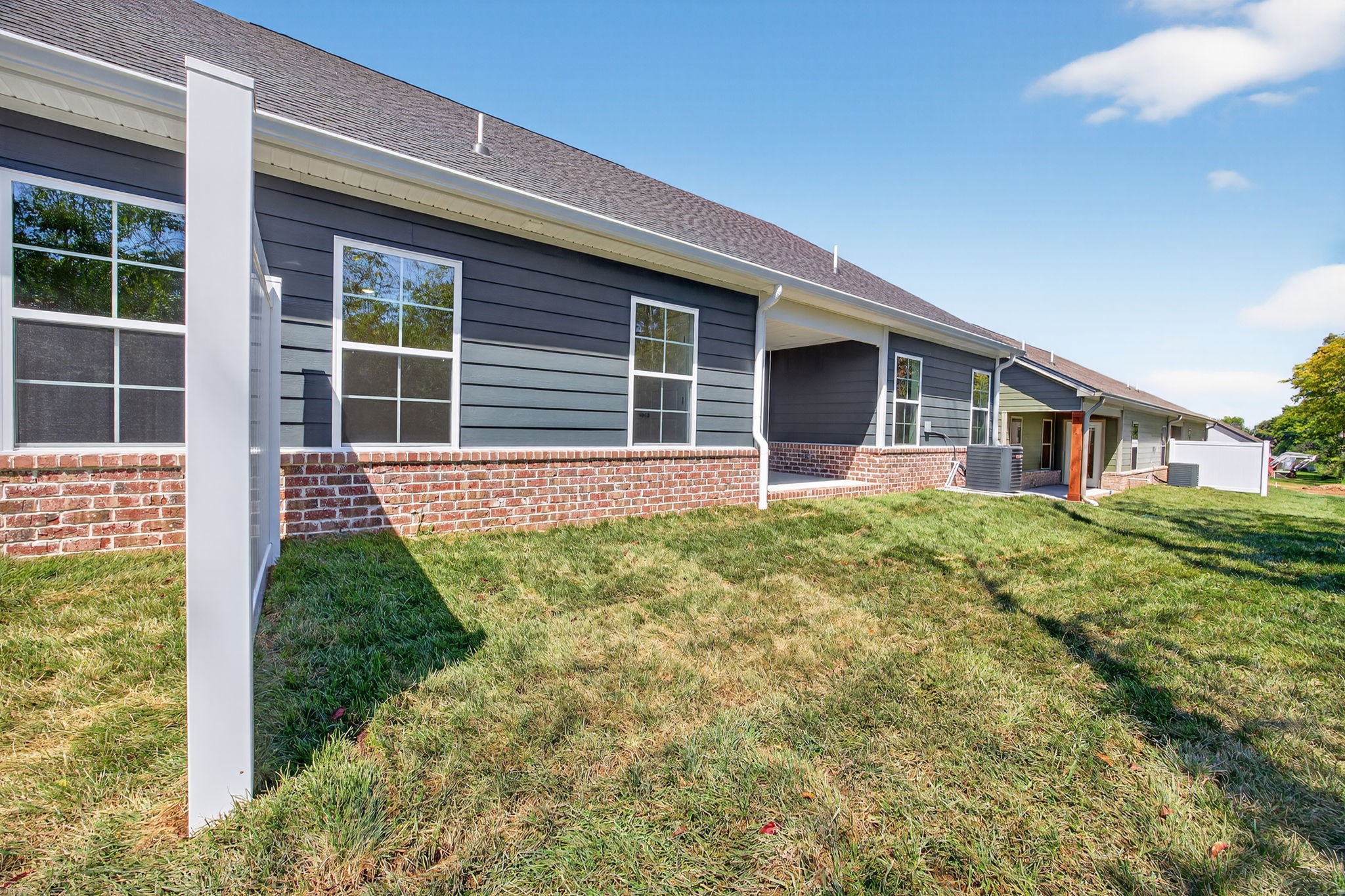 2111 Rylee Way, Unit 9 Greenbrier, TN 37073 - Photo 31 of 33 a front view of a house with garden