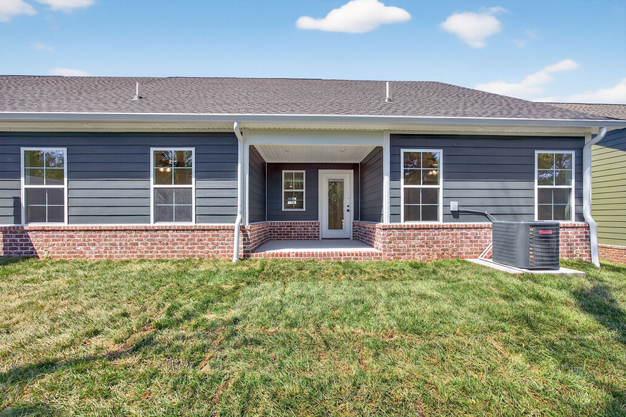 2111 Rylee Way, Unit 9 Greenbrier, TN 37073 - Photo 32 of 33 a front view of a house with a yard