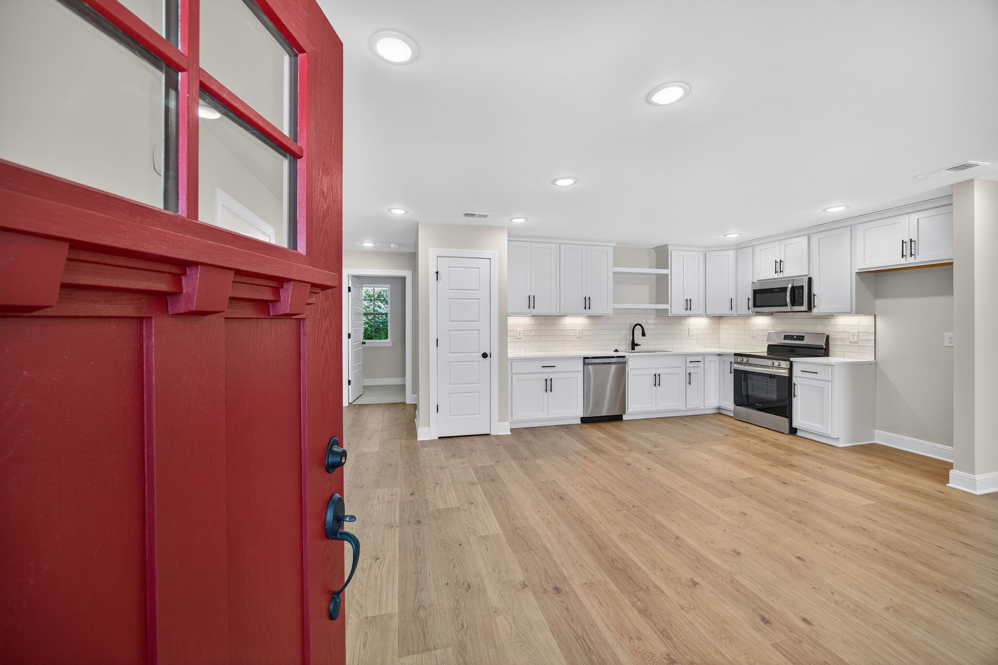 2111 Rylee Way, Unit 9 Greenbrier, TN 37073 - Photo 5 of 33 a large kitchen with stainless steel appliances a refrigerator and a stove top oven