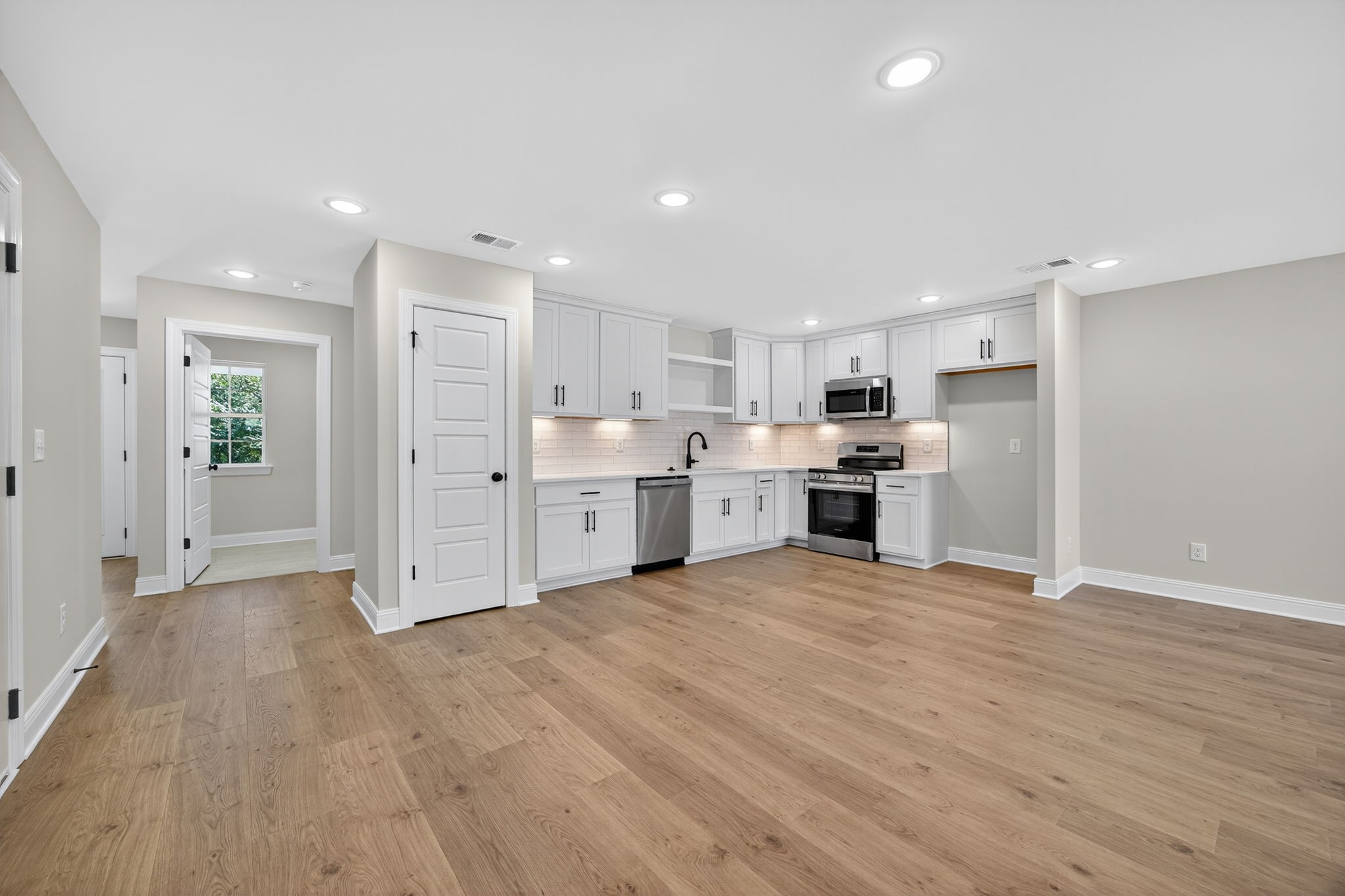 2111 Rylee Way, Unit 9 Greenbrier, TN 37073 - Photo 6 of 33 a view of kitchen with granite countertop a large counter top stainless steel appliances and cabinets