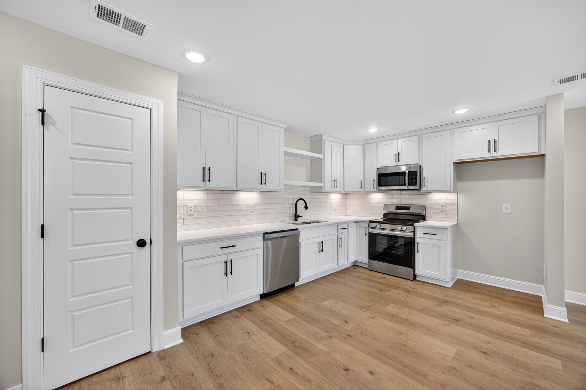 2111 Rylee Way, Unit 9 Greenbrier, TN 37073 - Photo 8 of 33 a kitchen with granite countertop white cabinets and stainless steel appliances