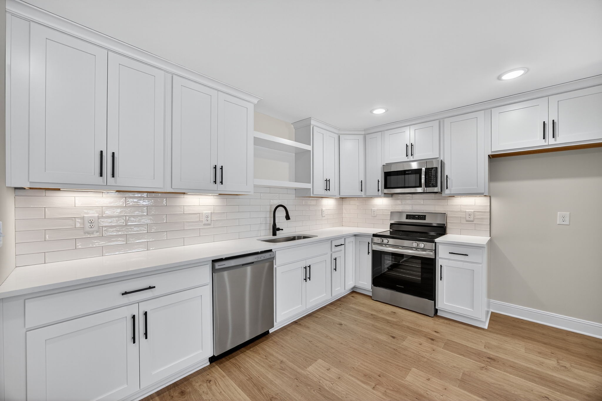2111 Rylee Way, Unit 9 Greenbrier, TN 37073 - Photo 9 of 33 a kitchen with granite countertop white cabinets and stainless steel appliances