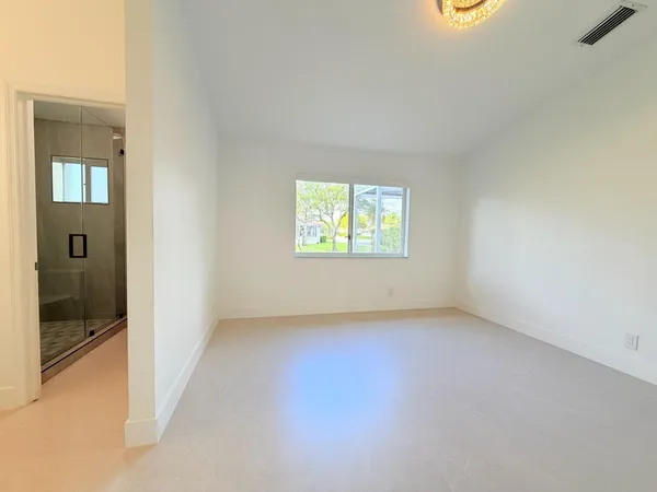 a bathroom with a double vanity sink mirror and toilet