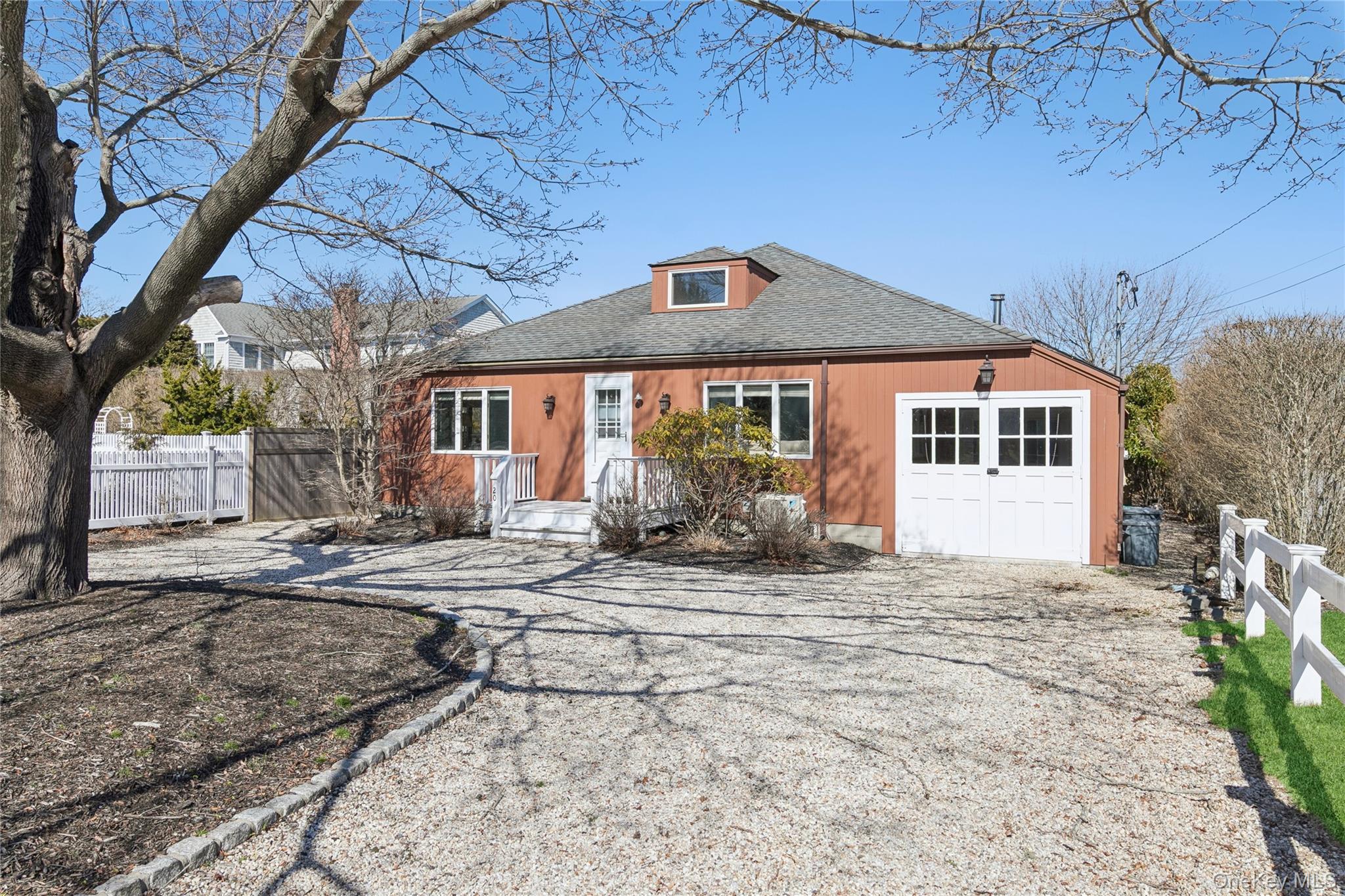 a backyard of a house with yard and outdoor seating