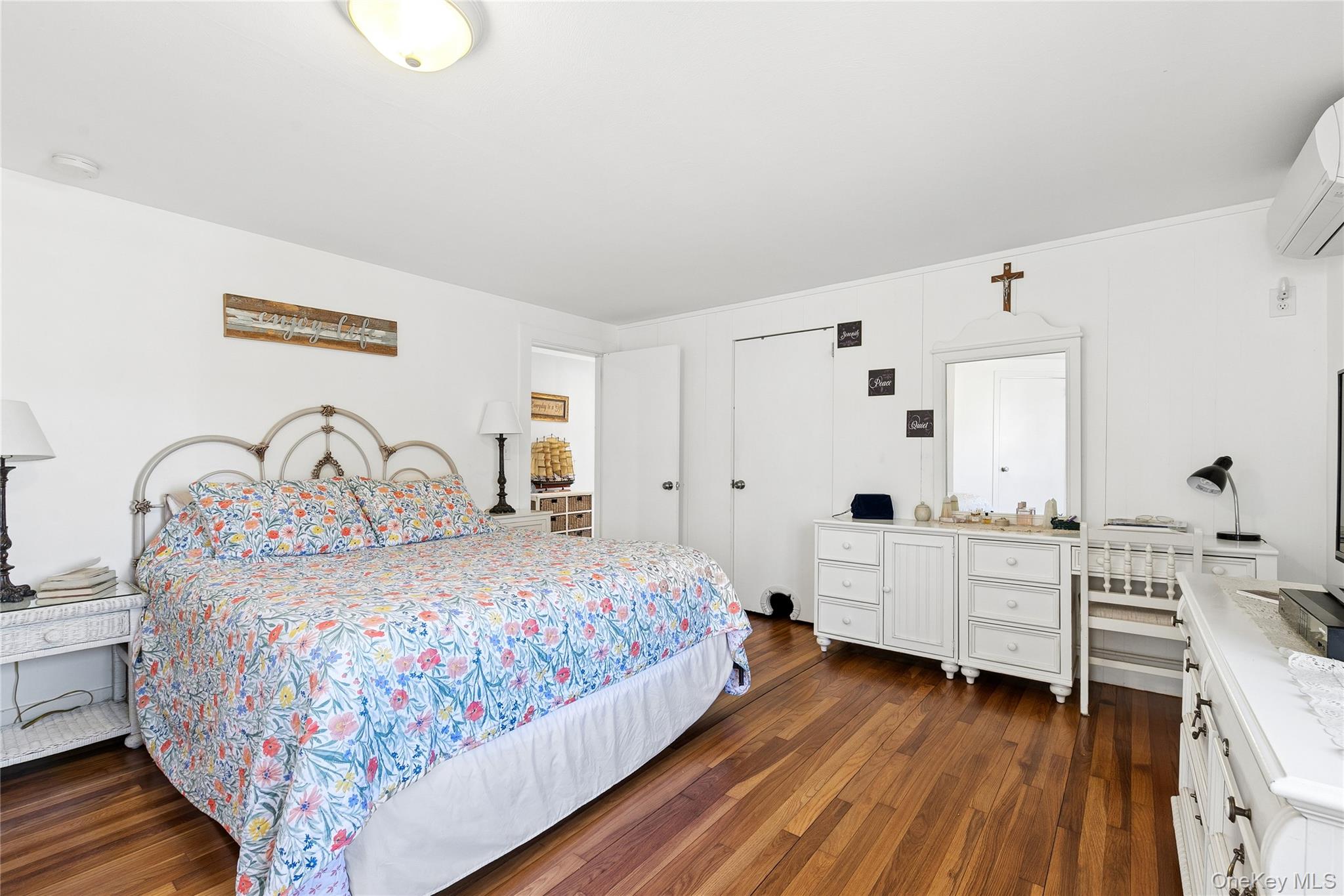 20 Mitchell Road Westhampton Beach, NY 11978 - Photo 13 of 34 a bedroom with a bed and a desk
