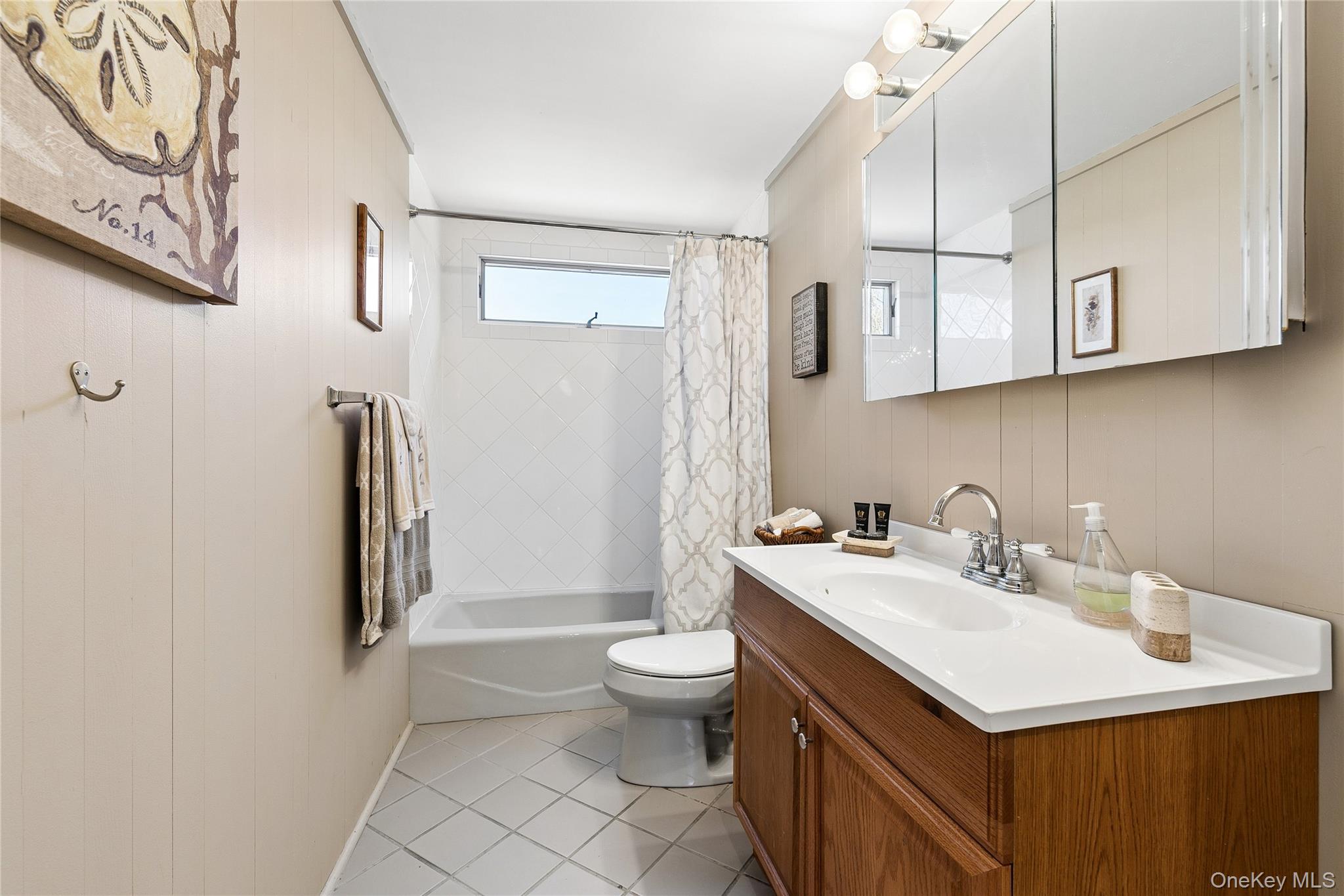20 Mitchell Road Westhampton Beach, NY 11978 - Photo 16 of 34 a bathroom with a sink toilet and mirror