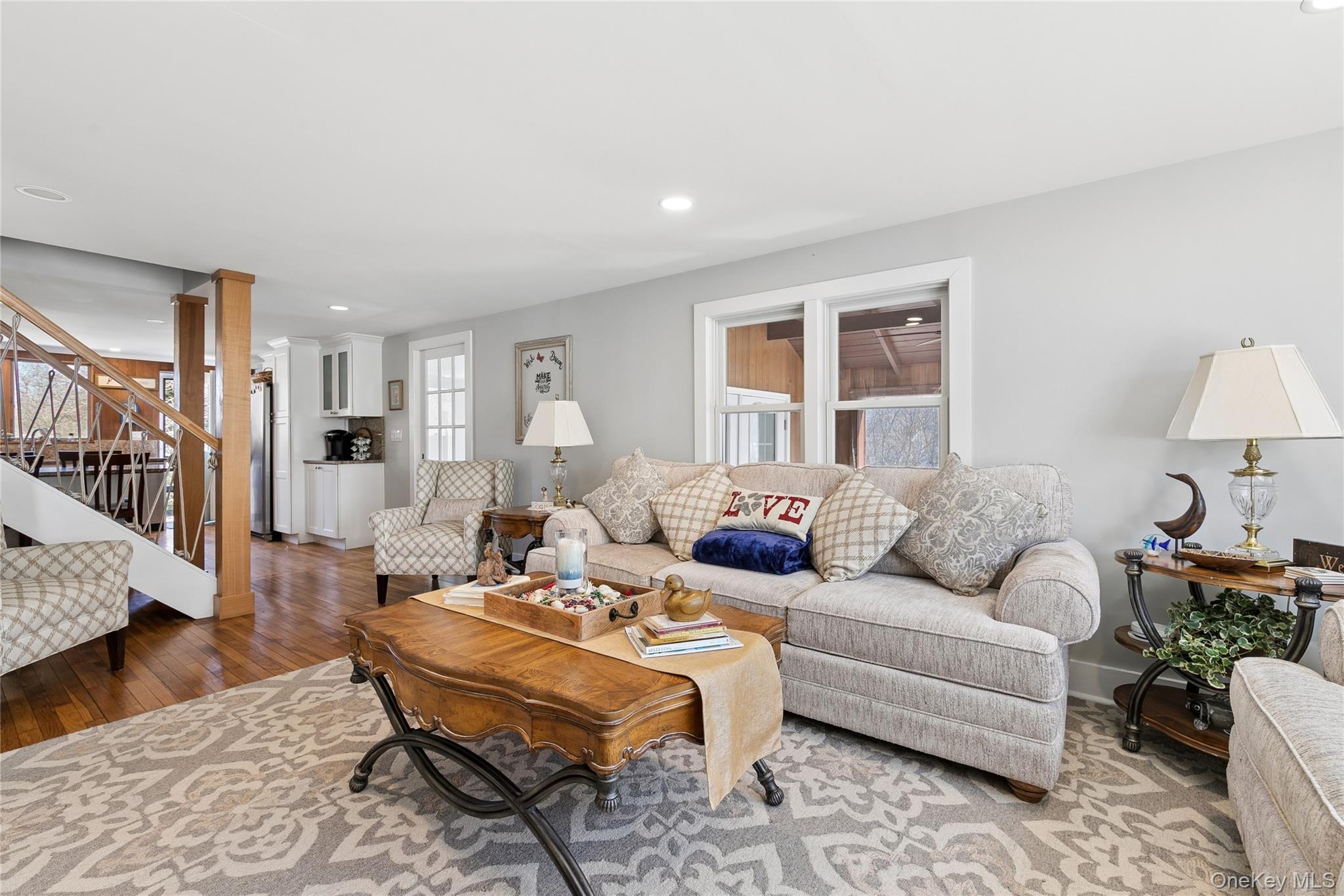 20 Mitchell Road Westhampton Beach, NY 11978 - Photo 6 of 34 a living room with furniture and a table
