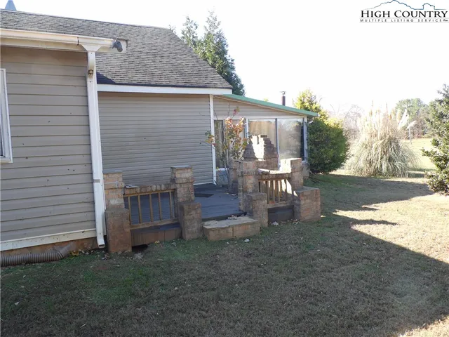 a view of garage and yard
