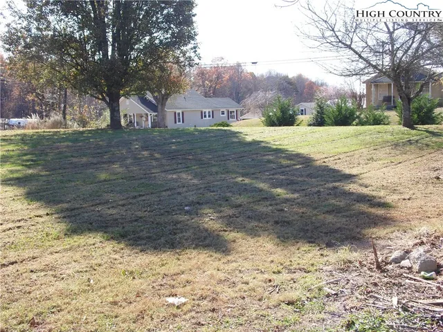 a view of hallway with wooden floor