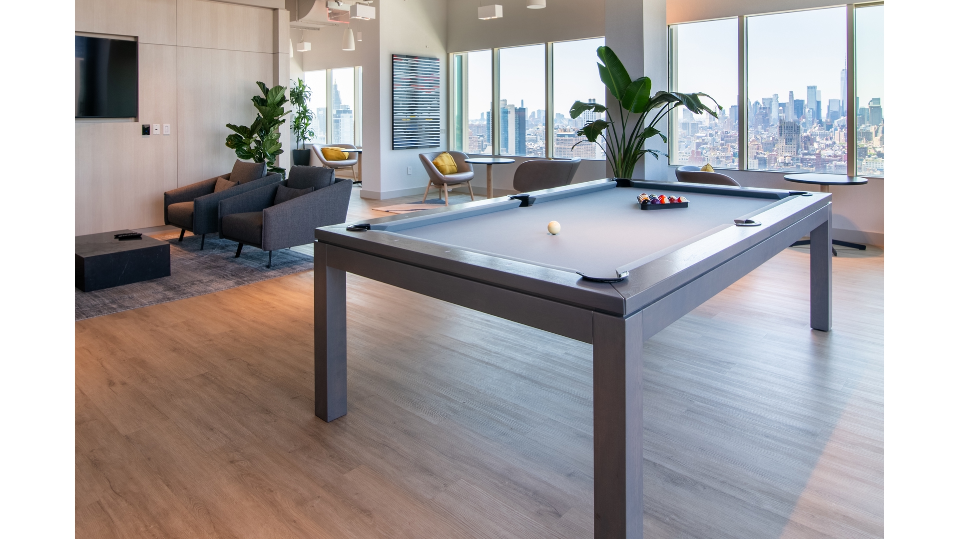 315 West 33rd Street, Unit 15N Manhattan, NY 10001 - Photo 10 of 12 a living room with furniture and potted plants