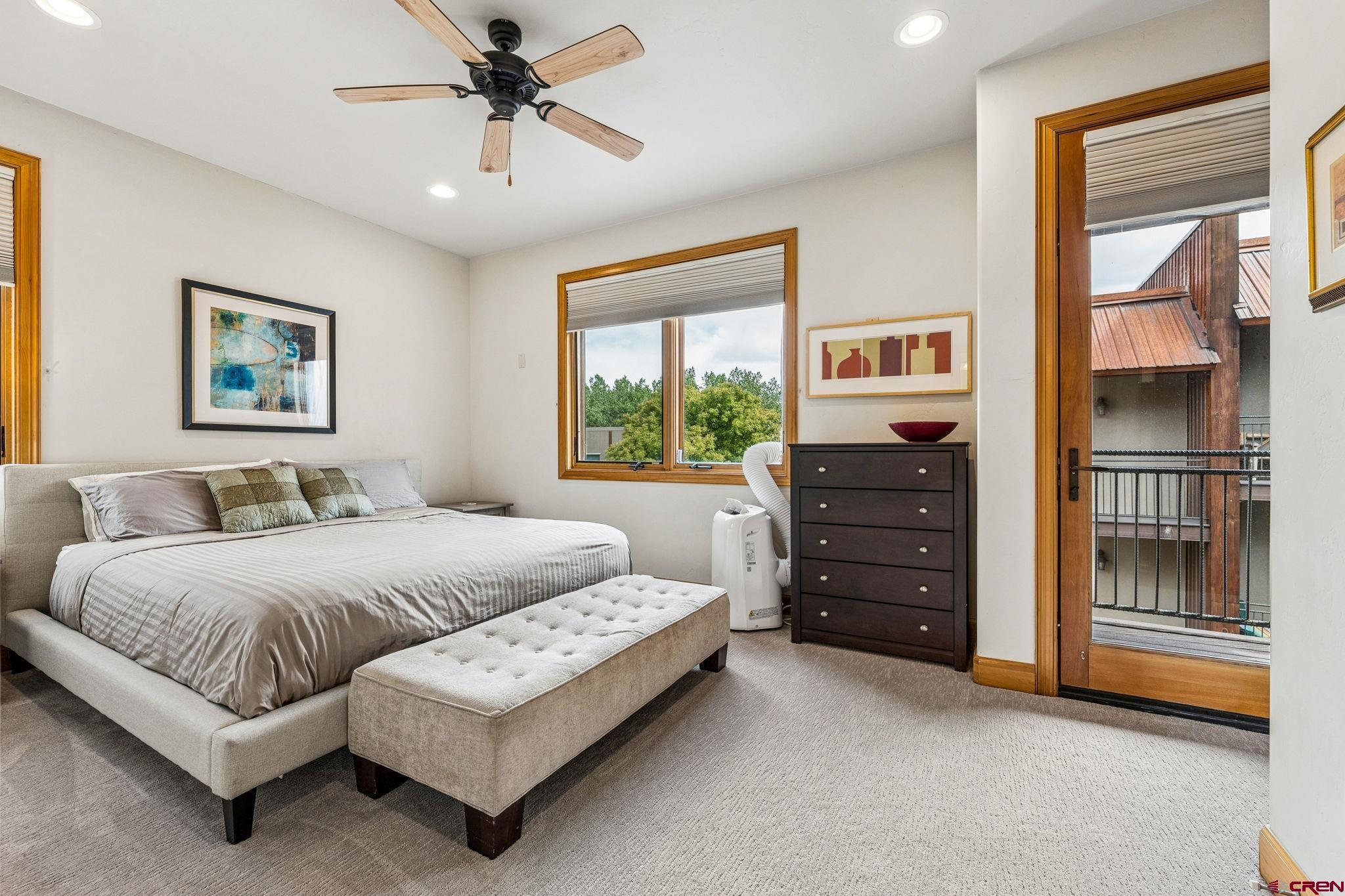 1422 Animas View Drive, Unit 55 Durango, CO 81301 - Photo 21 of 44 a bedroom with a bed dresser and a window
